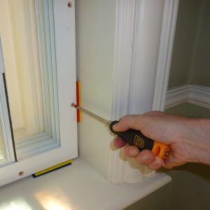 A man screwing in a screw