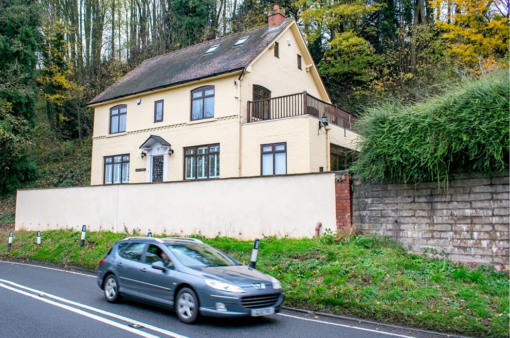 A house with a road outside it